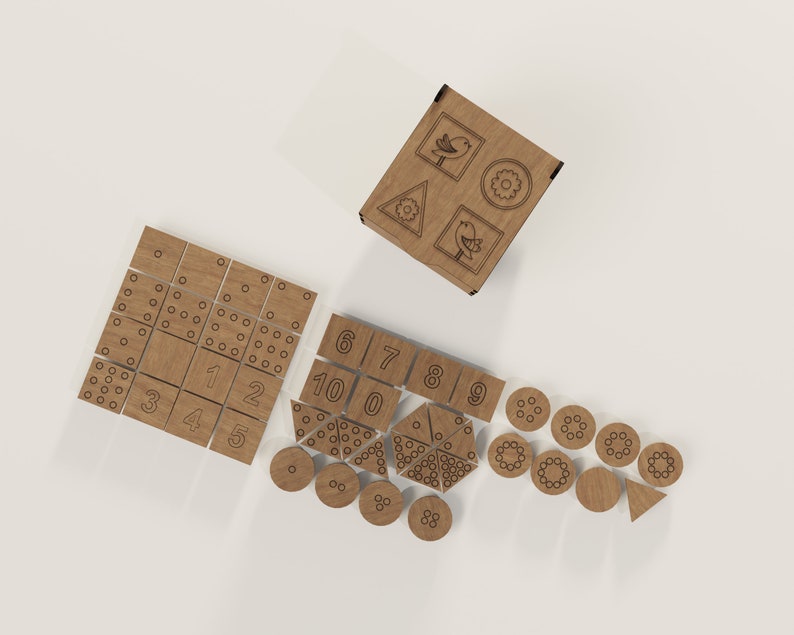 May include: Wooden game set with a variety of pieces, including a cube with symbols, squares with numbers and dots, and circles with dots. The pieces are made of light brown wood and have a natural finish.
