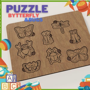 May include: A wooden puzzle with a brown background featuring a butterfly and bugs. The puzzle pieces are cut out in the shape of a butterfly, dragonfly, and beetles. The puzzle is labelled "Puzzle Butterfly & Bugs".