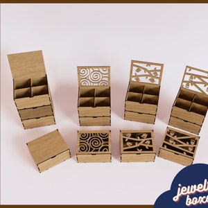 May include: Set of six wooden jewelry boxes with intricate laser cut designs. The boxes have a natural wood finish and feature different patterns, including swirls, branches, and birds. The boxes are stacked and arranged on a white surface.  The text "jewelry boxes" is printed in black on a white background.