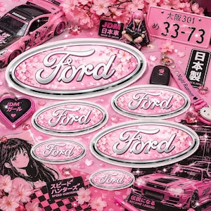 May include: Pink Ford emblem stickers with a cherry blossom design. The image features a pink car, a license plate, and a keychain. The text "JDM" and "Speed Hunters" are also visible.