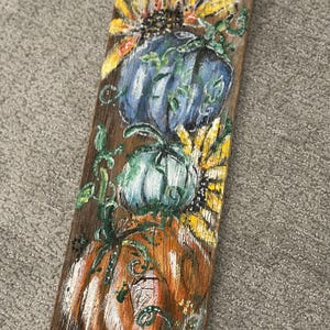 Pintura de abóbora em madeira recuperada