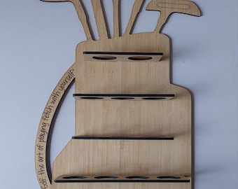 May include: Wooden golf bag wall decor with a quote: "Golf: The art of playing fetch with yourself."