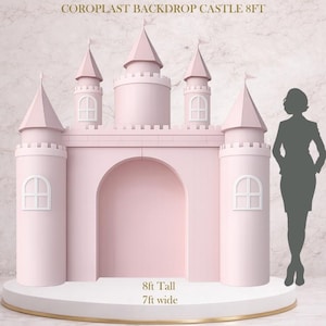 May include: A pink coroplast castle backdrop, 8ft tall and 7ft wide, with four turrets, arched doorway, and white window details. The text "COROPLAST BACKDROP CASTLE 8FT" is at the top. The castle sits on a white platform with a gold trim.