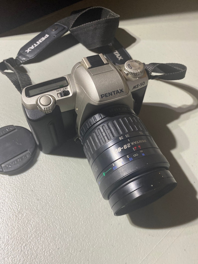 35mm Camera Pentax ZX-10 And ZX-60 Cameras With More Camera