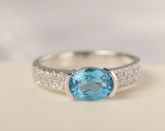 Swiss Blue Topaz 14k Gold Ring: Oval Cut Bezel Set - November Birthstone