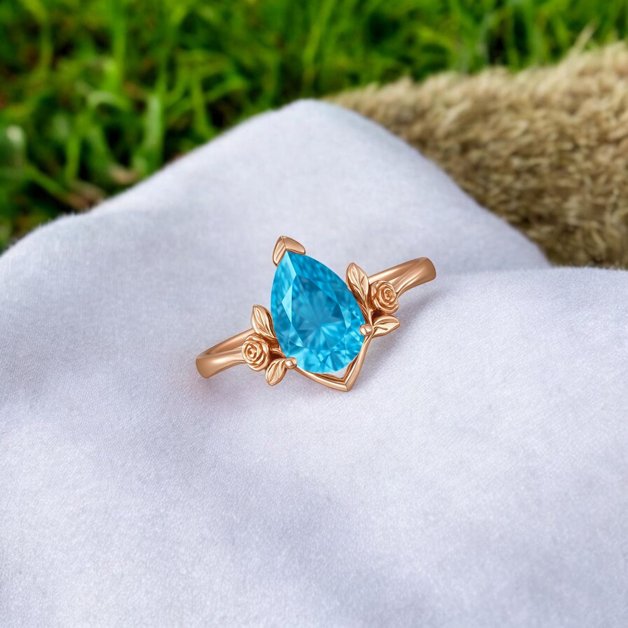 ラボで作られたブルートパーズリング：スターリングシルバーのリーフ