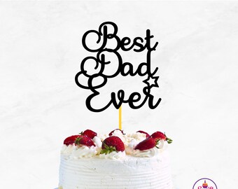 May include: Black cake topper with the text "Best Dad Ever" in a cursive font. The topper is on top of a white cake with strawberries.