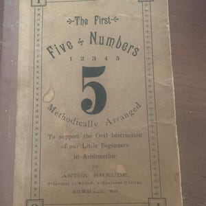 May include: Vintage educational book titled "The First Five Numbers" with the number 5 prominently displayed. The cover is tan with black text and decorative borders. The book is designed to support oral instruction in arithmetic.