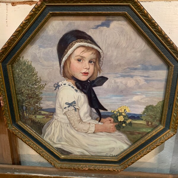 1900s “Girl with Yellow Flowers,” artist Corneille Max, hexagon-shaped framed print with glass cover, approx. 10” x 1.25”