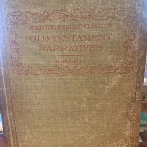 May include: An antique book with a faded green cover. The title "Old Testament Narratives" is printed in red, along with the author's name, "Baldwin." The book's cover has a textured appearance and shows signs of age.