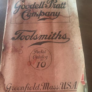 May include: Vintage pocket catalog cover with the text "Goodell-Pratt Company Toolsmiths" in black script. The cover is a faded reddish-brown color with the words "Pocket Catalog 10" in a circle. The bottom of the cover reads "Greenfield, Mass. U.S.A."