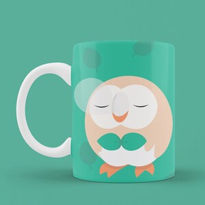 May include: A white ceramic mug with a green background and a cartoon owl with closed eyes. The owl is holding green leaves in its hands.