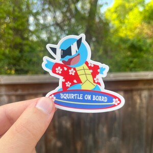 May include: A blue and yellow cartoon Squirtle wearing sunglasses and a red and white Hawaiian shirt is riding a blue surfboard with the text "Squirtle on Board".