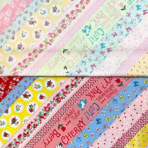 May include: A fabric with a diagonal stripe pattern featuring a variety of floral prints and the text "Cherry Cute! Pink & Berry Strawberry Flowers" in pink and blue.