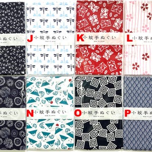 May include: Eight rectangular fabric cloths arranged in two rows, each featuring distinct patterns including dragonflies, cats, cherry blossoms, mountains, and geometric shapes. Each cloth is wrapped with a white paper band labeled with Japanese text.