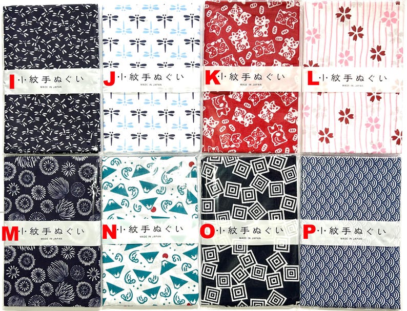 May include: Eight rectangular fabric cloths arranged in two rows, each featuring distinct patterns including dragonflies, cats, cherry blossoms, mountains, and geometric shapes. Each cloth is wrapped with a white paper band labeled with Japanese text.