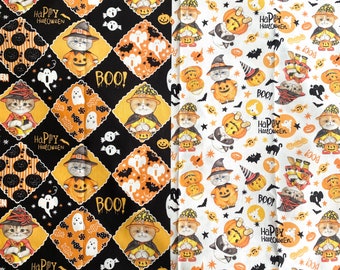 May include: Black and white fabric with a repeating pattern of orange pumpkins, black bats, white ghosts, and cats dressed in witch costumes holding pumpkins. The text "Happy Halloween" and "Boo!" are repeated throughout the fabric. The fabric is next to a white fabric with a repeating pattern of orange pumpkins, black bats, white ghosts, and cats dressed in witch costumes holding pumpkins. The text "Happy Halloween" and "Boo!" are repeated throughout the fabric.