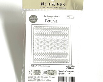 May include: A packaged Sashiko sampler kit featuring a Petunia design. The kit includes English instructions and features a finished size of approximately 13.4 x 13.4 inches. The design is printed on 100% cotton fabric, with markings that disappear when washed.