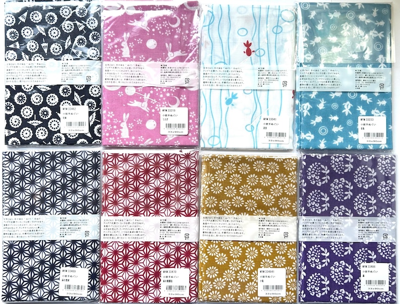 May include: Eight rectangular fabric cloths in individual clear plastic packaging, each featuring distinct patterns including geometric shapes, floral motifs, rabbits, and fish in various colors like navy, pink, white, blue, red, gold, and purple.