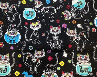 May include: Black fabric with a repeating pattern of colorful sugar skull cats. The cats are wearing flowers and have skeletal bones. The background is black with white polka dots and colorful flowers.