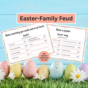 May include: Printable Easter-themed Family Feud game with two cards. The first card asks "Name something you would find in an Easter basket" with answers like "Chocolate", "Candy/Jelly Beans", "Decorated Eggs", and "Fake Grass". The second card asks "Name a popular Easter song" with answers like "Up From the Grave He Arose", "In Your Easter Bonnet", "Easter Parade", and "The Bunny Hop".