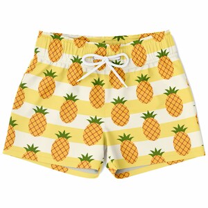 May include: Yellow and white striped swim trunks with a pineapple pattern.