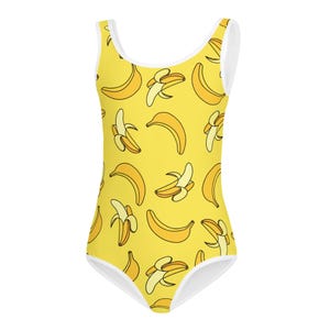May include: A yellow one-piece swimsuit with a white trim and a pattern of yellow bananas.