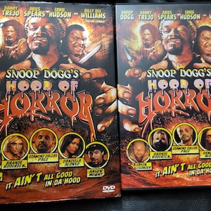 May include: Two DVDs of "Snoop Dogg's Hood of Horror" are shown. The covers feature Snoop Dogg and other actors, with the title in orange and red. The tagline "It Ain't All Good in Da Hood" is also visible.