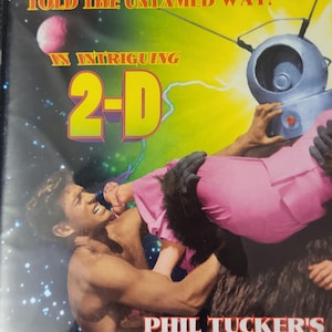 May include: A DVD case with the title "Phil Tucker's Bobo." The cover features a man in a struggle with a robot-like figure. Text includes "Incredible! Unbelievable! Told the Untamed Way!" and "In Intriguing 2-D."