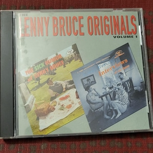 May include: A CD case featuring "The Lenny Bruce Originals Volume 1." The cover art includes images from "The Sick Humor of Lenny Bruce" and "Bruce Interviews of Our Time." The text is in red and white on a light green background.