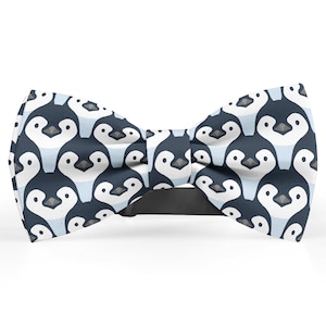 May include: A blue bow tie with a white penguin pattern.