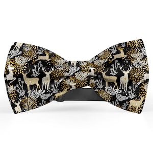 May include: A black bow tie with a gold and white pattern of stylized deer and fireworks.
