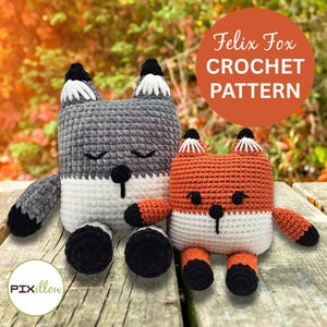 May include: Two crocheted fox toys, one gray and one orange, sit side-by-side on a wooden surface. The gray fox has white and black accents, while the orange fox has white and black accents. The image includes the text "Felix Fox CROCHET PATTERN".