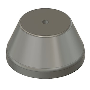 May include: A gray, round, pedestal with a small hole in the center. The pedestal is made of a smooth, hard material and has a slightly flared base.