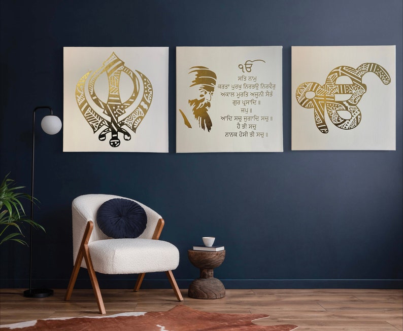 White and gold foil Sikh wall art set displayed above modern living room sofa