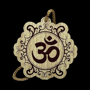 May include: A wooden Om symbol pendant with a decorative border and a gold-coloured cord for hanging. The Om symbol is in a dark brown colour, set against a light wood grain background. The pendant has a scalloped edge.