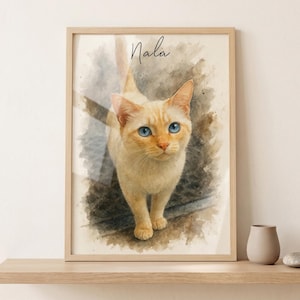 May include: A framed watercolor print of a cat named Nala. The cat has light orange fur and striking blue eyes. The artwork is set against a soft, textured background, with the cat's name written in cursive at the top.