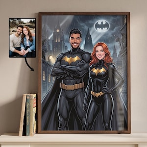 May include: A framed artwork featuring a couple as Batman and Batgirl, set against a cityscape backdrop with the Batman symbol. The artwork is in a wooden frame, with a smaller photo of the couple attached.