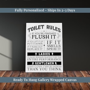May include: A white canvas print with black text that reads "TOILET RULES" and other bathroom-related instructions. The canvas is gallery wrapped and ready to hang.