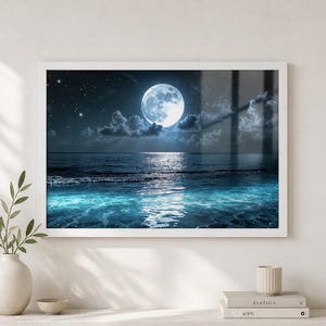 Ocean Wall Art showing a moonlit seascape painting with a bright full moon, deep night sky, glowing cloud edges, reflective water, and luminous blue waves rolling toward the shore. The tranquil coastal scene creates soothing Moon Wall Decor for a bedroom, bathroom, beach house, living room, or relaxing home decor space.