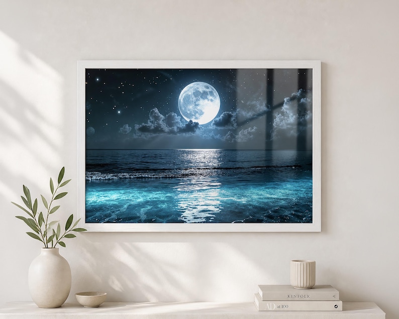 Ocean Wall Art showing a moonlit seascape painting with a bright full moon, deep night sky, glowing cloud edges, reflective water, and luminous blue waves rolling toward the shore. The tranquil coastal scene creates soothing Moon Wall Decor for a bedroom, bathroom, beach house, living room, or relaxing home decor space.