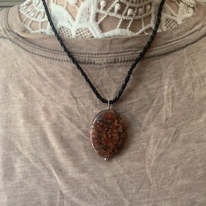 Polished granite stone pendant