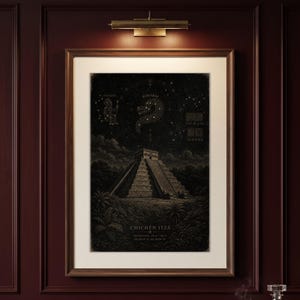 May include: A framed art print featuring a dark, nocturnal illustration of the Chichén Itzá pyramid surrounded by jungle foliage. Above the pyramid, the night sky displays constellations labelled Itzamna and Kukulcan, with text reading CHICHÉN ITZÁ.