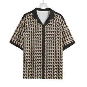 May include: Short-sleeved button-down shirt with a geometric pattern in beige, black, and red. The shirt features a black collar, trim, and cuffs. The shirt is hanging on a white hanger.