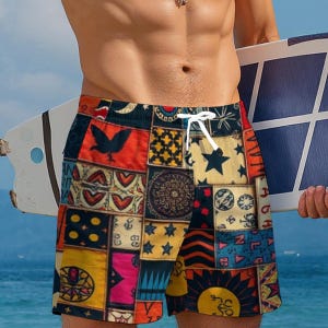 May include: Swim trunks with a patchwork design featuring various patterns and colors, including stars, suns, and geometric shapes. The trunks have a white drawstring and are held near a surfboard.
