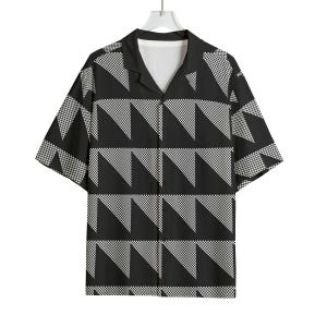 May include: Black and white patterned short-sleeve shirt. The shirt features a geometric design of alternating black triangles and white checkered triangles. The shirt is hanging on a white hanger.