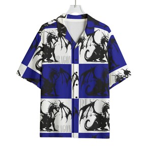 May include: Short-sleeved button-down shirt with a dragon pattern. The shirt features a white and blue checkered design with black dragon illustrations. The word "DRAGON" is printed vertically on the shirt.