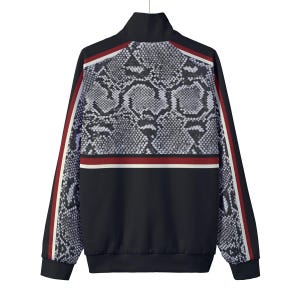 May include: A black track jacket featuring a grey and black snakeskin print on the upper back and sleeves. The garment includes a high collar, long sleeves with red and white side stripes, and a horizontal red and white stripe across the back.
