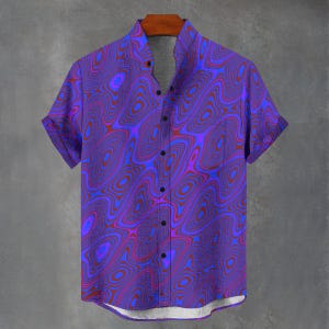 May include: A short-sleeved button-down shirt with a vibrant, swirling pattern in shades of purple, red, and blue. The shirt features a mandarin collar and black buttons. The design creates a psychedelic, eye-catching effect.