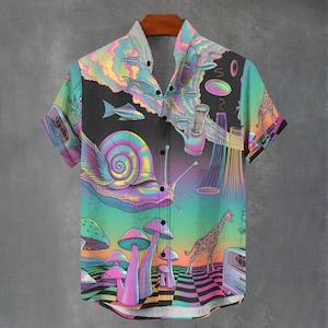 May include: Short-sleeved button-down shirt with a vibrant, psychedelic design. The shirt features a black background with colorful illustrations of a snail, fish, mushrooms, a giraffe, and other surreal elements. The color palette includes shades of pink, blue, green, and yellow.